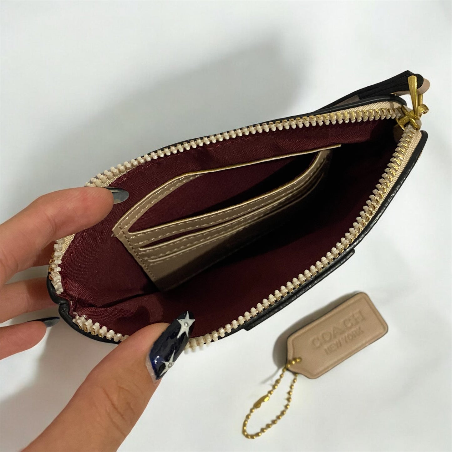 Muñequera tipo Coach