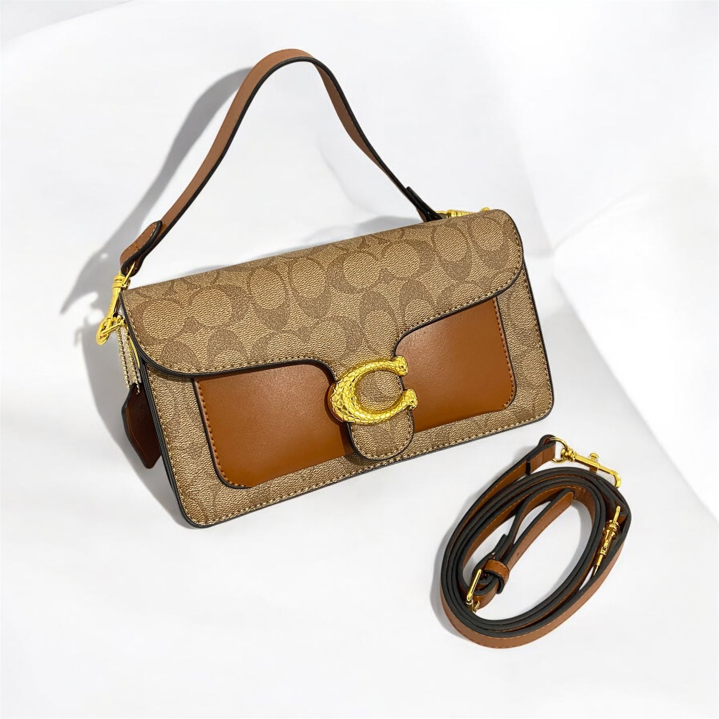 Tabby, tipo Coach, broche con textura